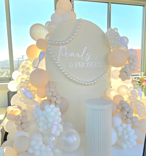Pearls and Prosecco backdrop setup